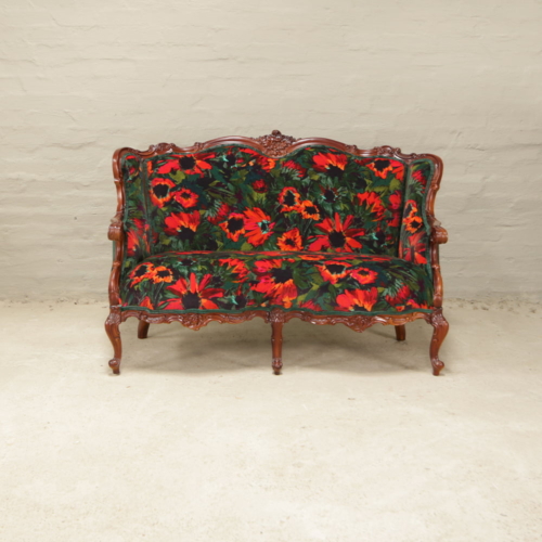antique french carved sofa in bright colours
