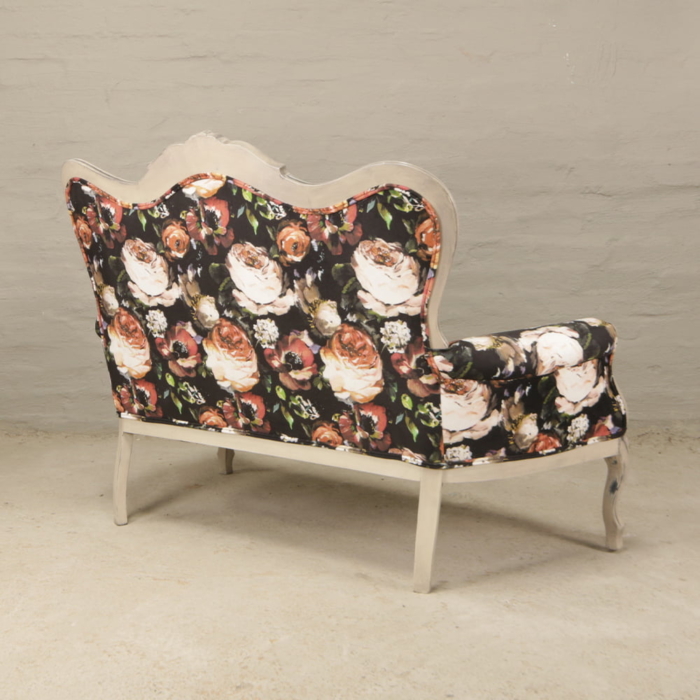 victorian carved sofa with floral velvet