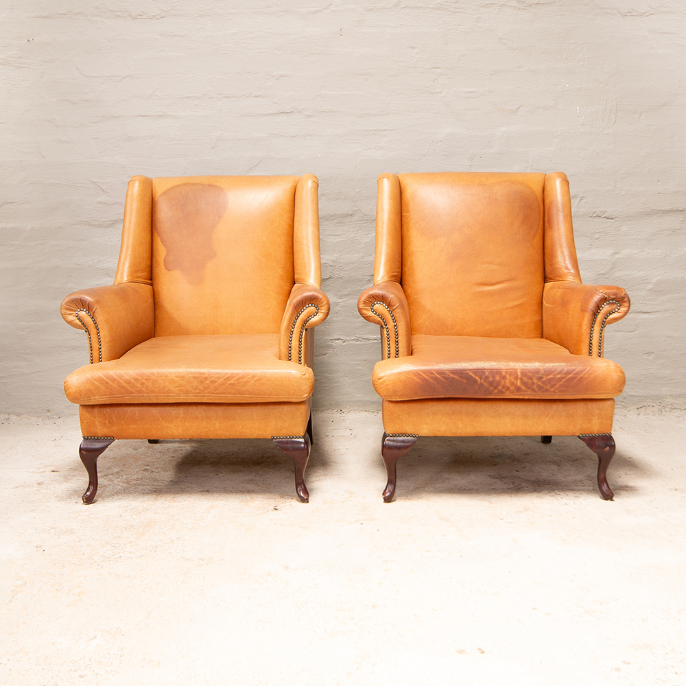 Vintage high back armchairs in leather